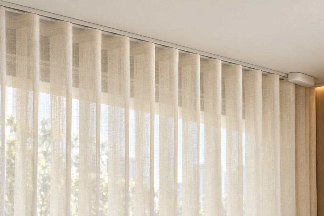 Ivory sheer curtain on a ceiling track